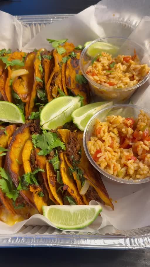 Seven birria tacos with rice and lime
